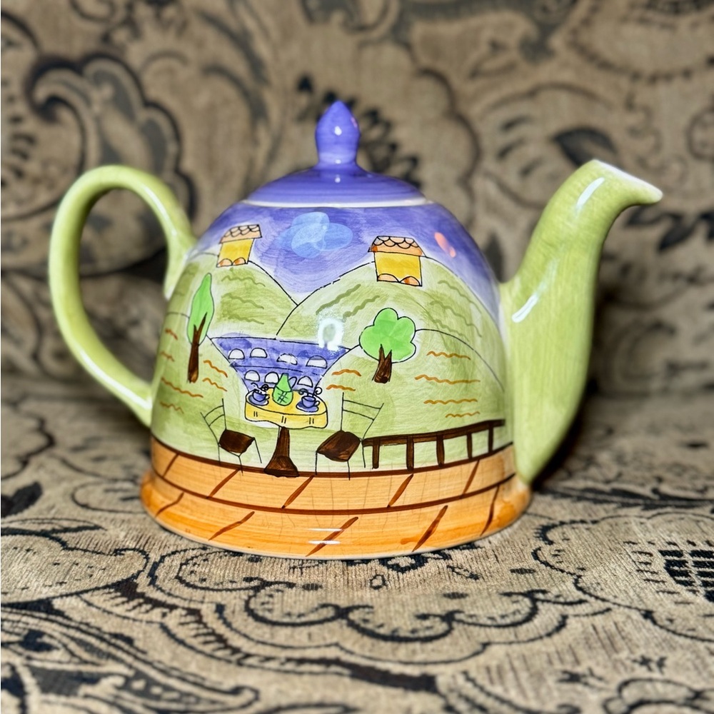 Playful Green and Blue Ceramic Teapot Art